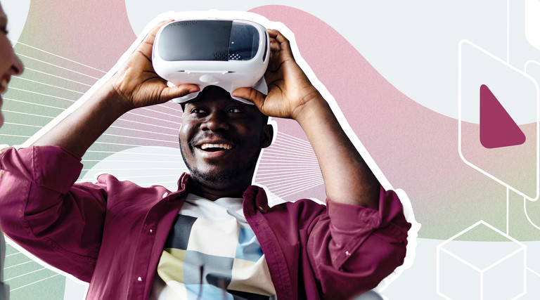 A man lifts a virtual reality headset off his eyes