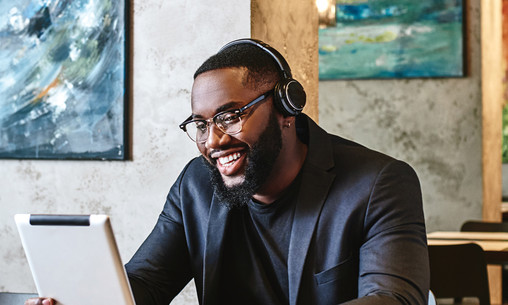 Man wearing headphones while working