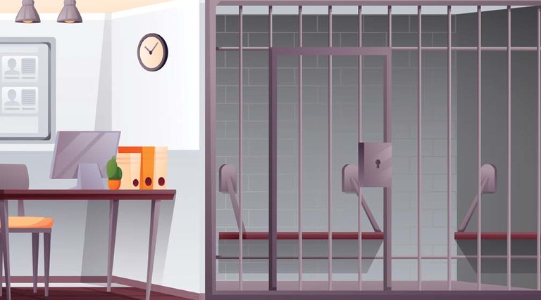 An illustration of a jail cell and desk