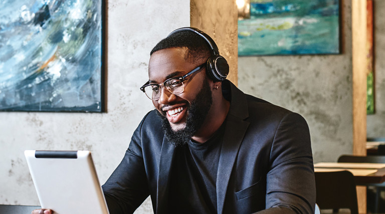 Man wearing headphones while working