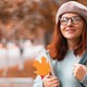 A young woman on a college campus in fall