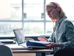 A woman studies with her laptop