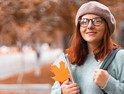A young woman on a college campus in fall