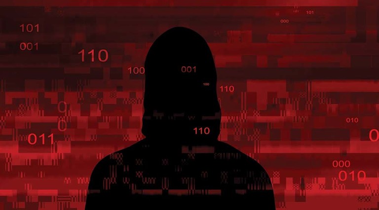 Shrouded image of a hacker
