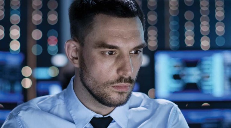 A man works at a workstation