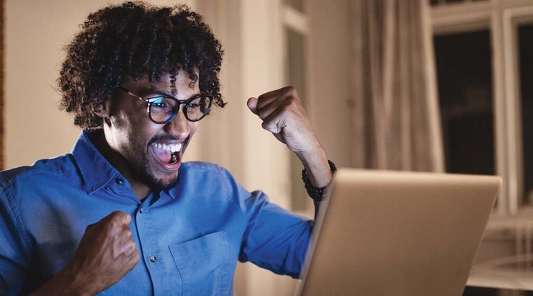 A student celebrates his success