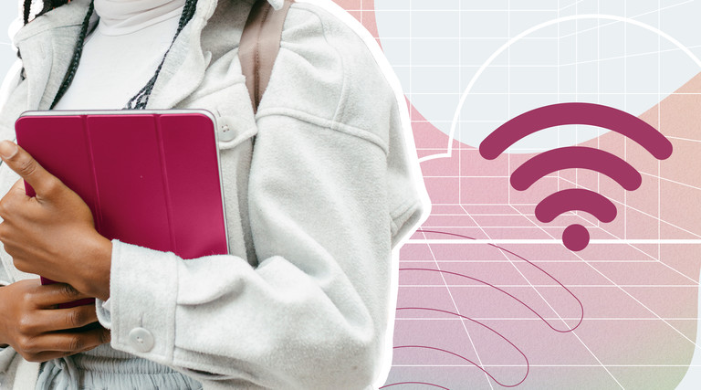 A woman holds a tablet device