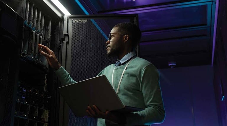 Black man working on a data center
