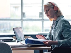 A woman studies with her laptop