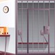 An illustration of a jail cell and desk