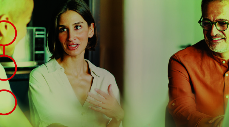 Three people engaged in a conversation