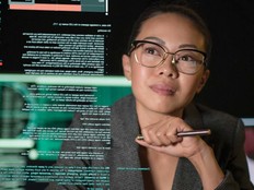 A woman looks at a transparent display