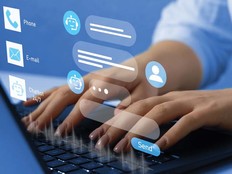 Illustration of chatbot superimposed over hands typing at laptop