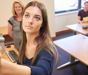 Girl writing on whiteboard