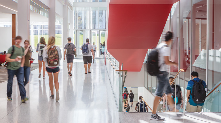 UMD students walking in learning center