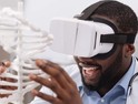 Black man using VR in his STEM studies at an HBCU