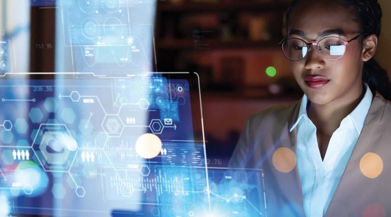 A woman is working with technology