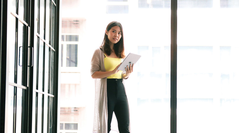 Woman working on a college transcript with blockchain