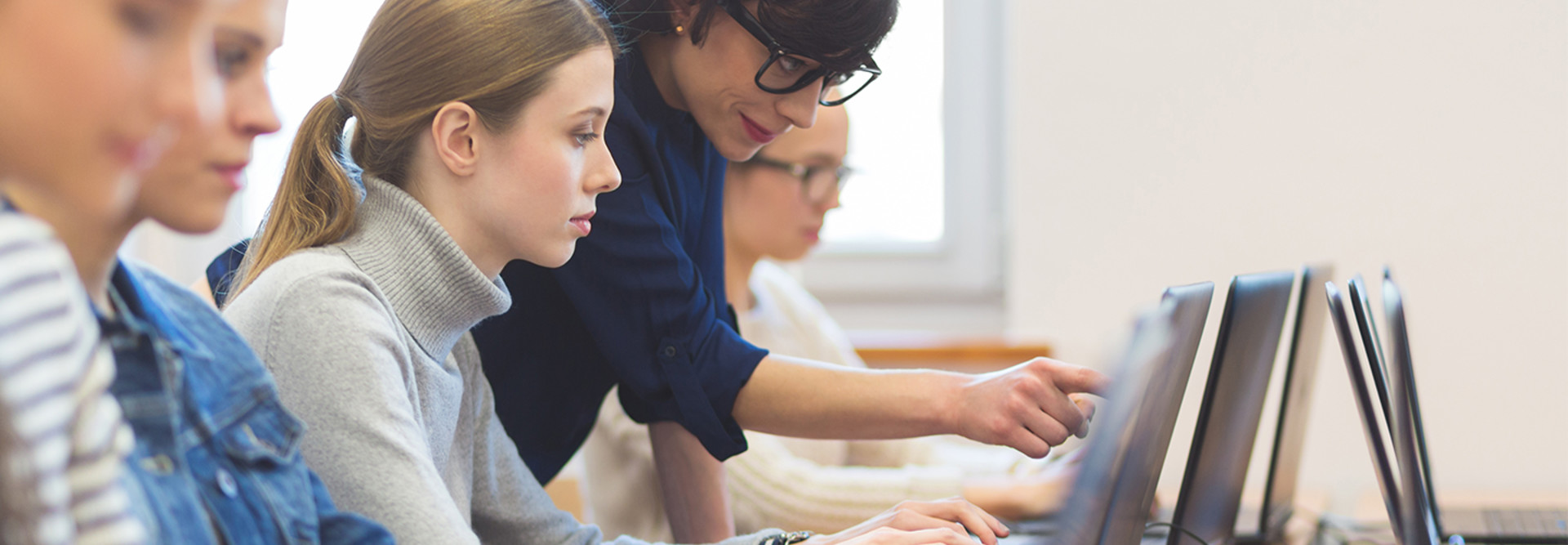 Woman teaching cybersecurity on computer
