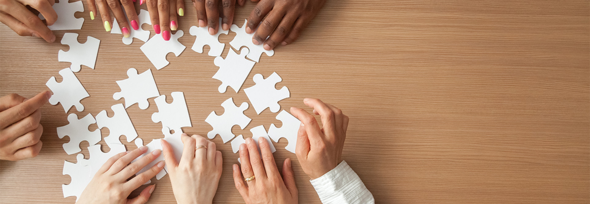 People work to put a puzzle together