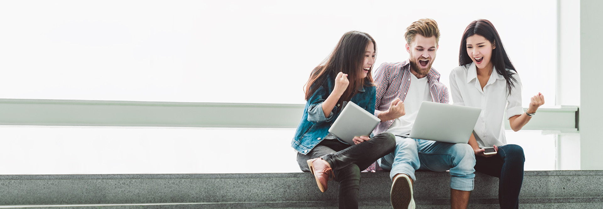 College Students excited about laptop