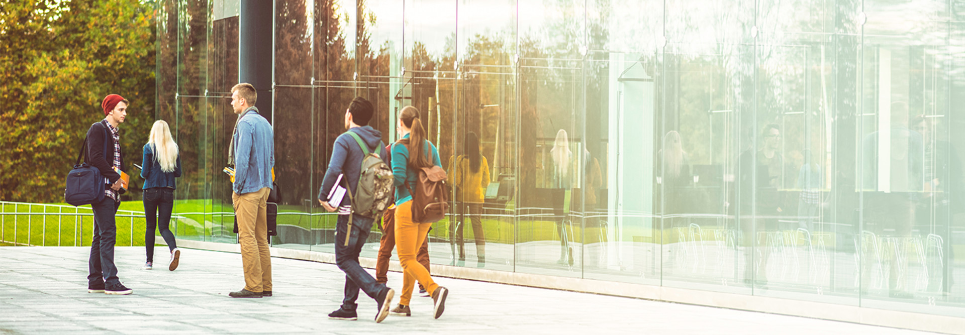 Kids walking by campus building