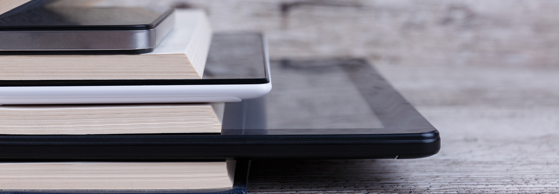 Books and tablets stacked