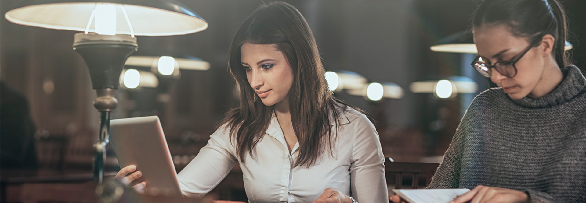 Girl on tablet in the library