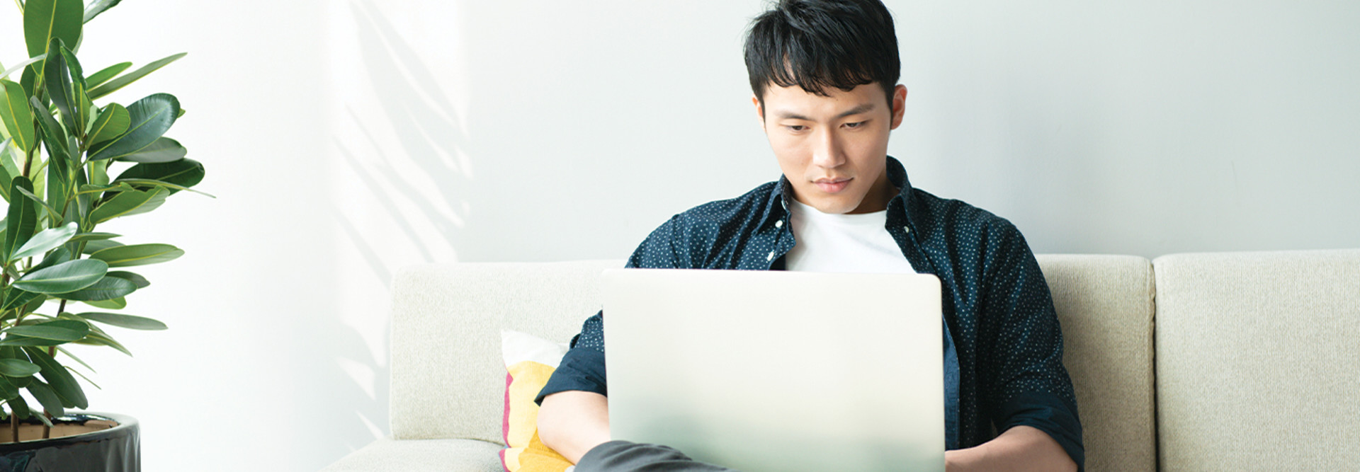 college student using laptop at home