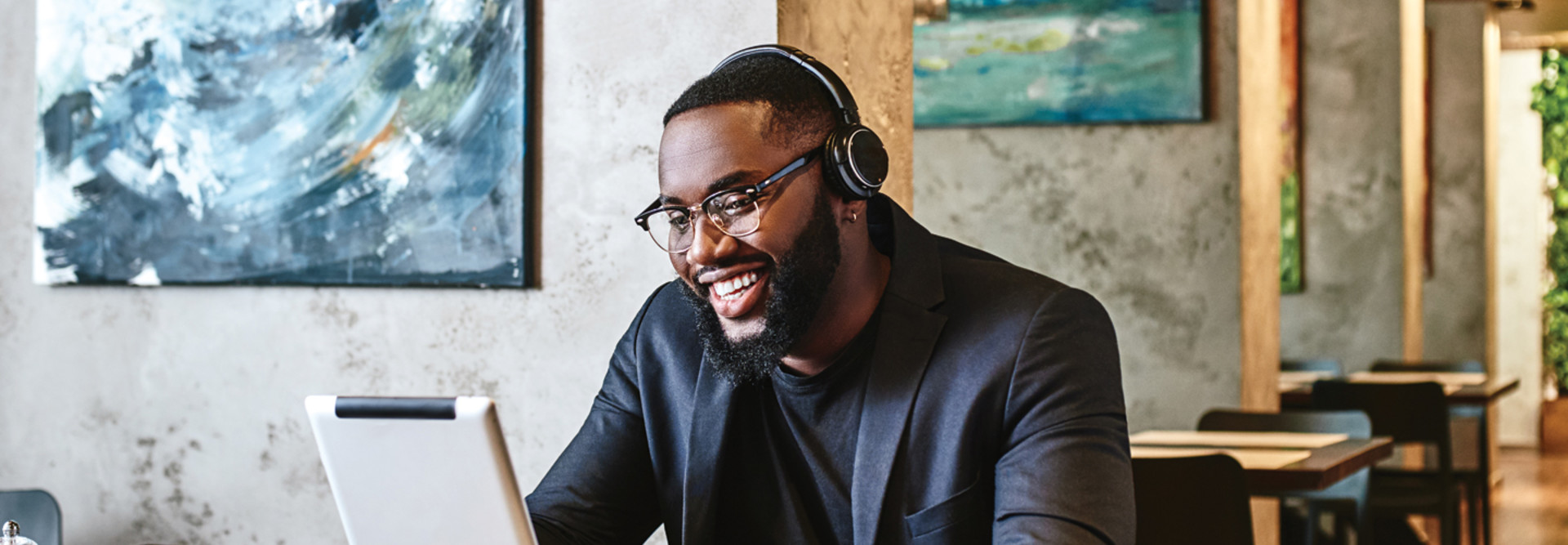 Man wearing headphones while working