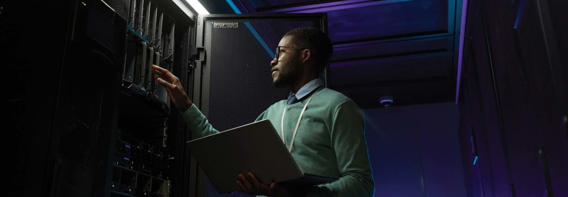 Black man working on a data center