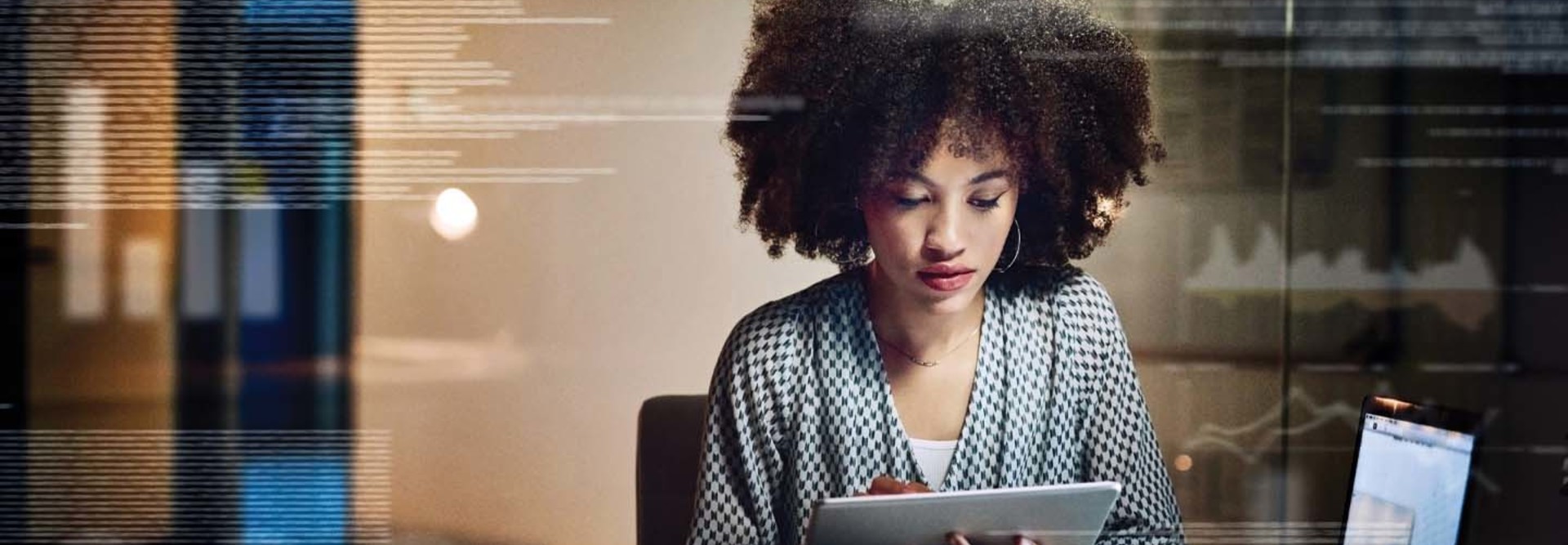 A woman works at a tablet