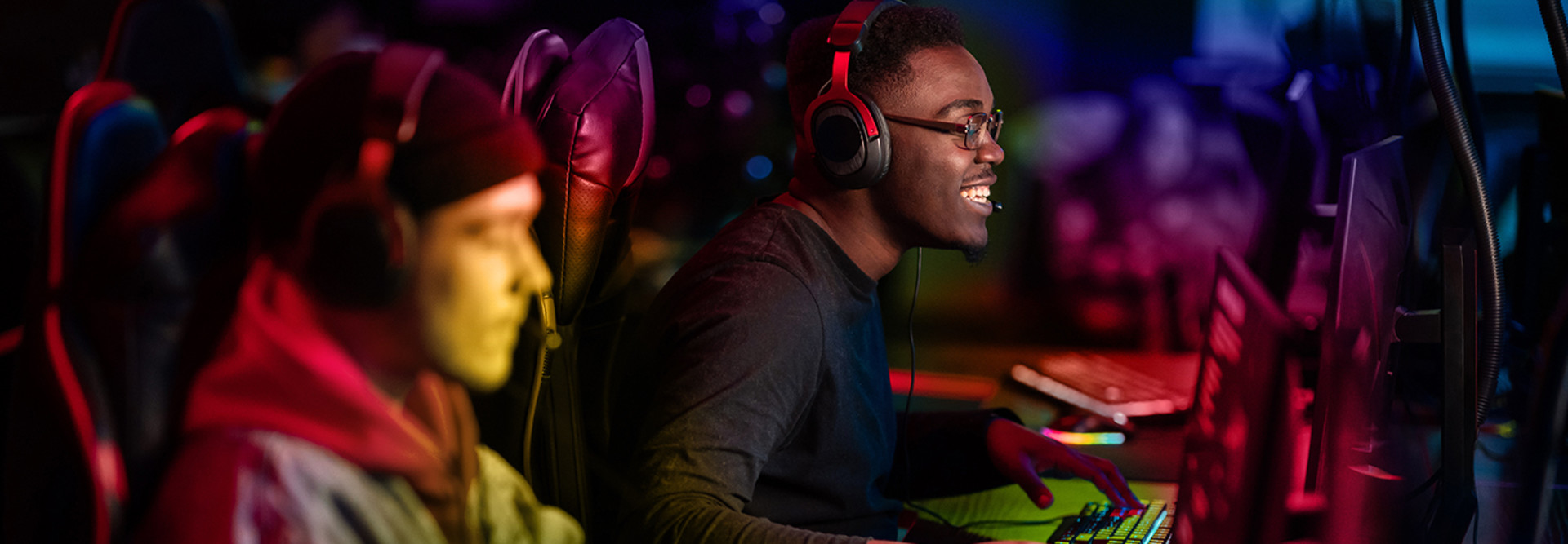 Two gamers play in an esports arena