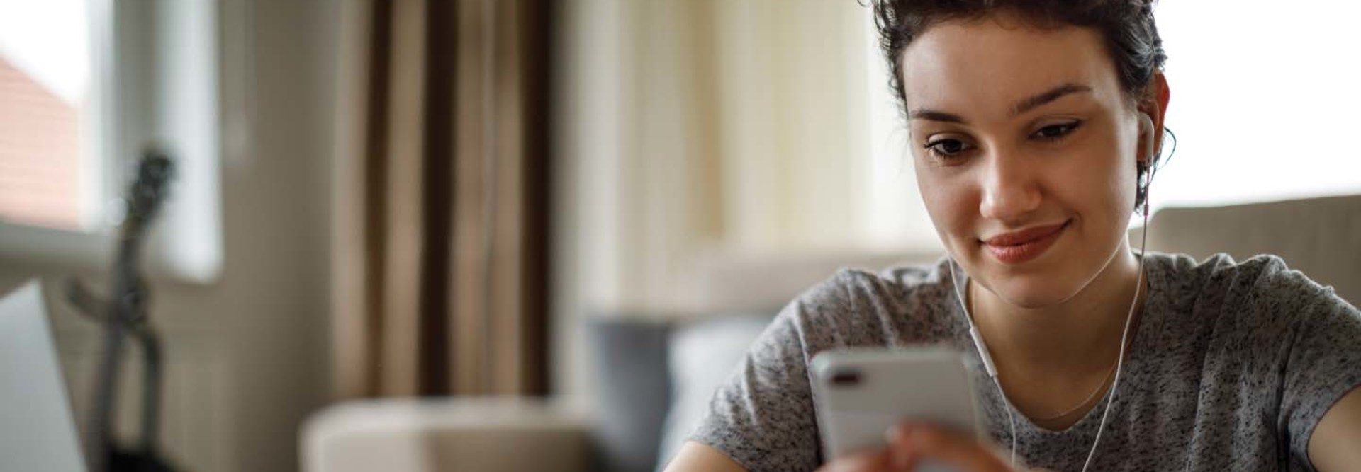 A college student looks at her cell phone.