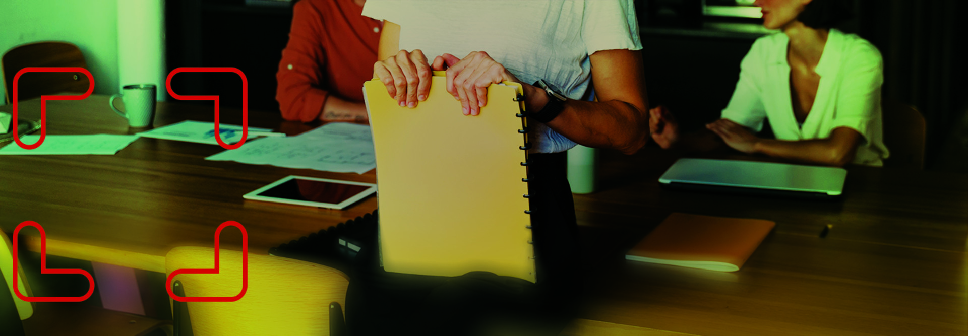 A person holds a notebook on their lap
