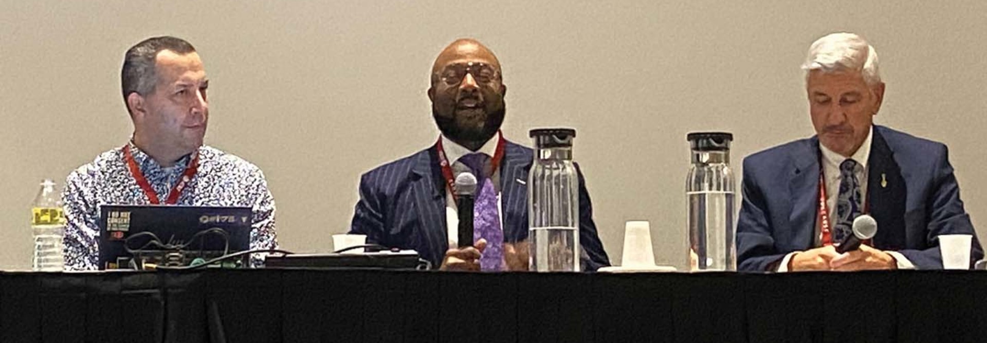 Three panelists address the crowd at EDUCAUSE 2022