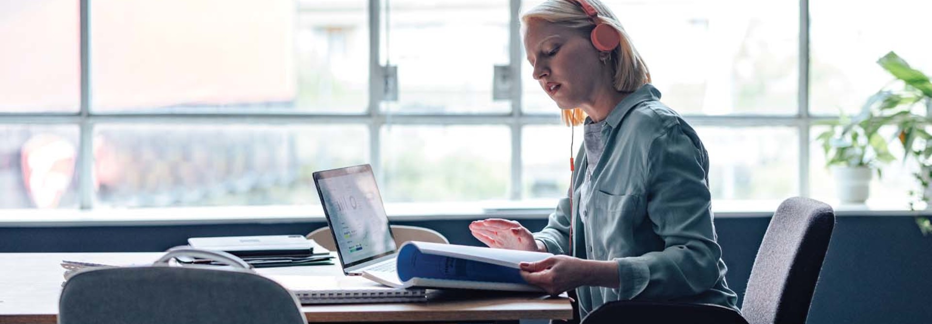 A woman studies with her laptop