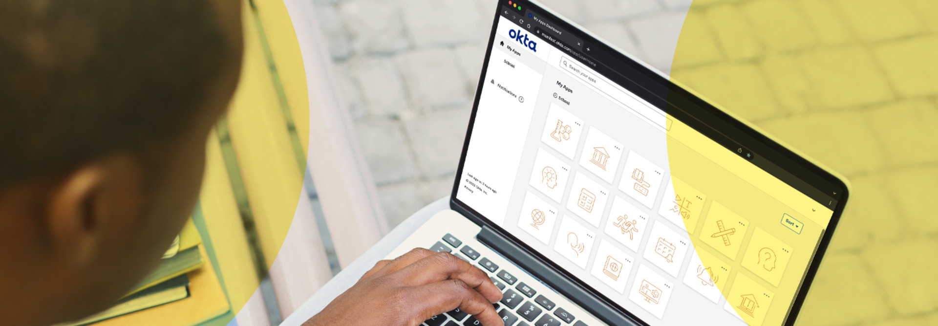 A person uses Okta on their device