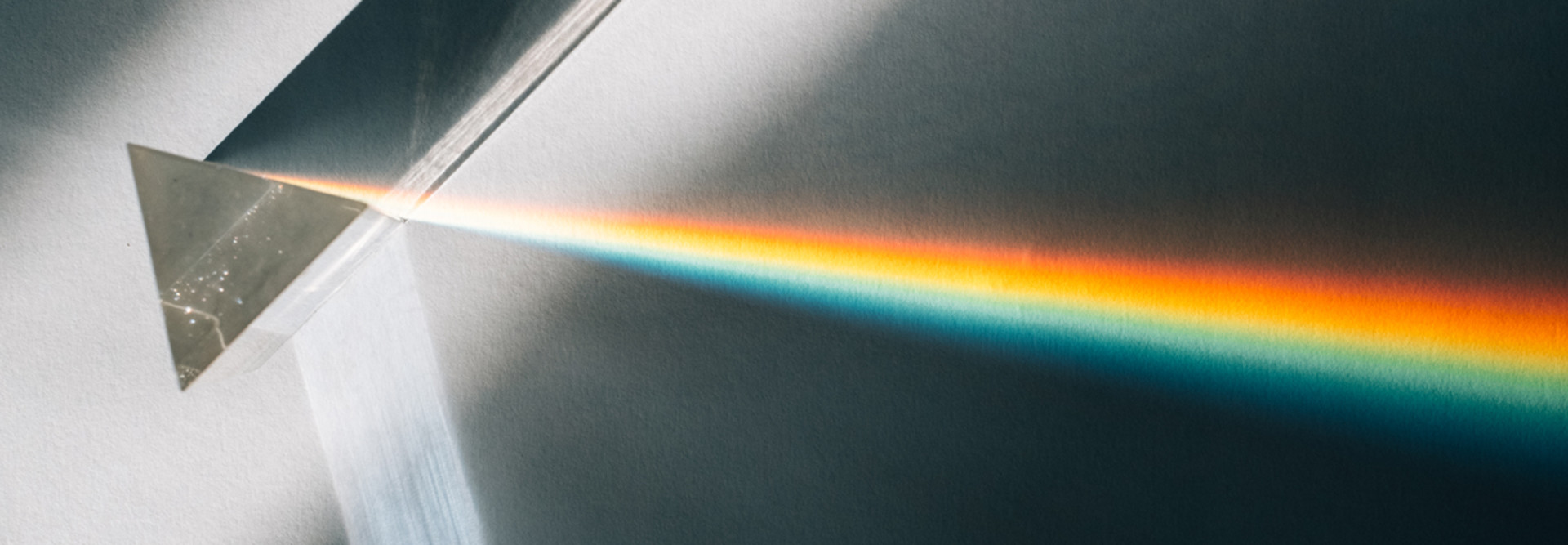 A beam of light shines through a prism