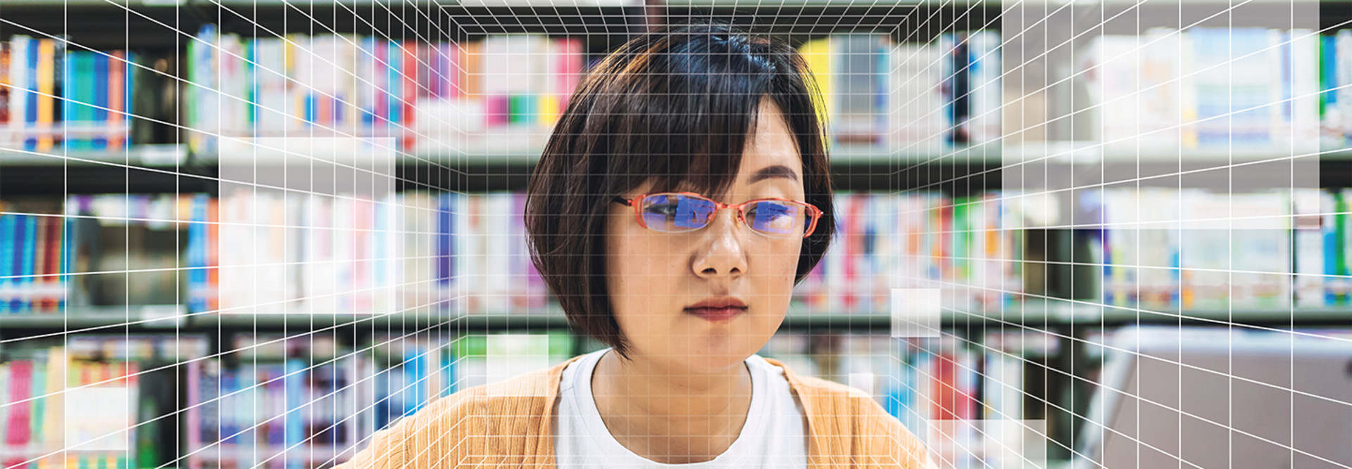 A woman's face behind a grid