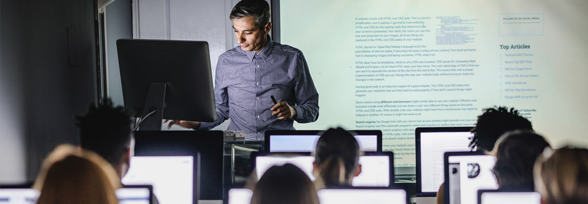 Professor teaching from computer