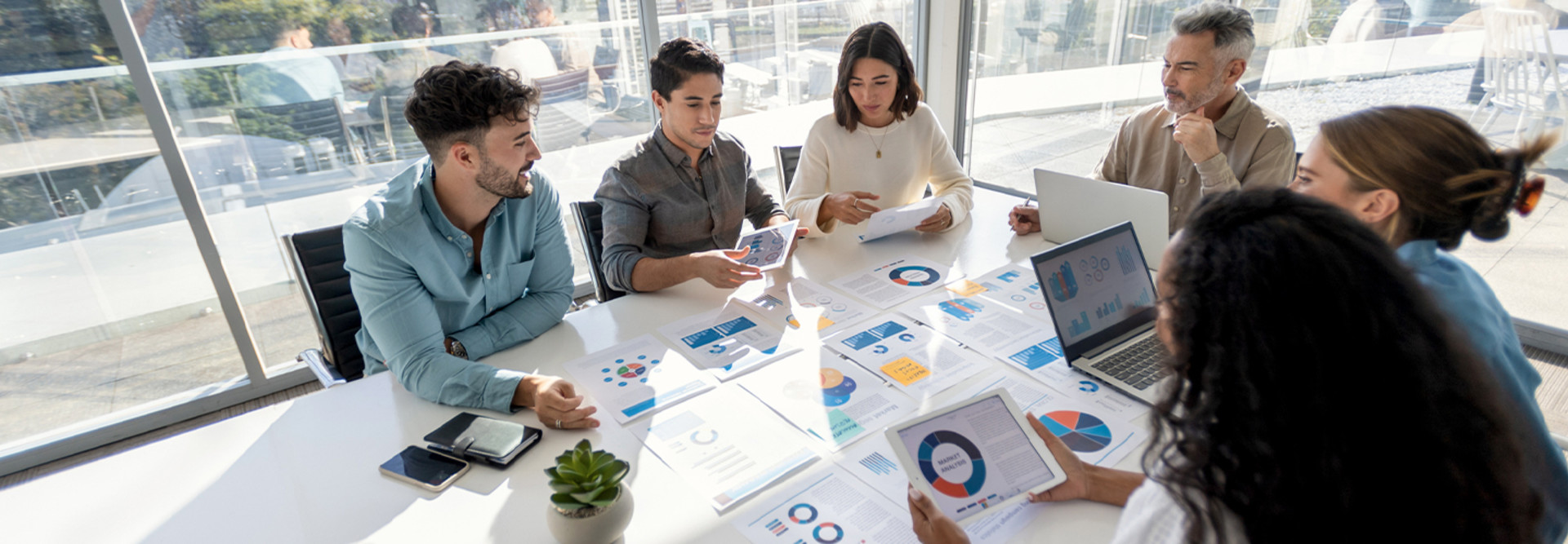 Group of individuals reviewing data