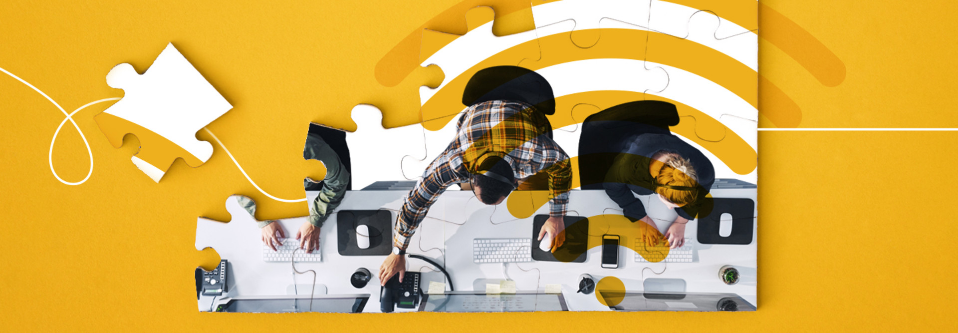 People working on desktops in an office