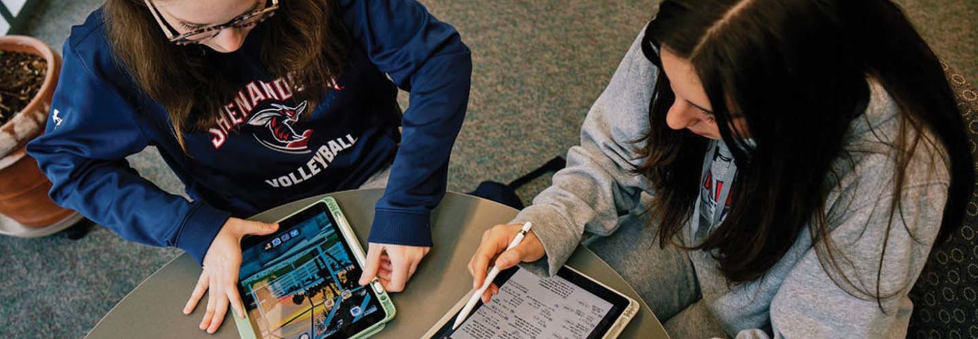 Shenandoah University students use technology at a table