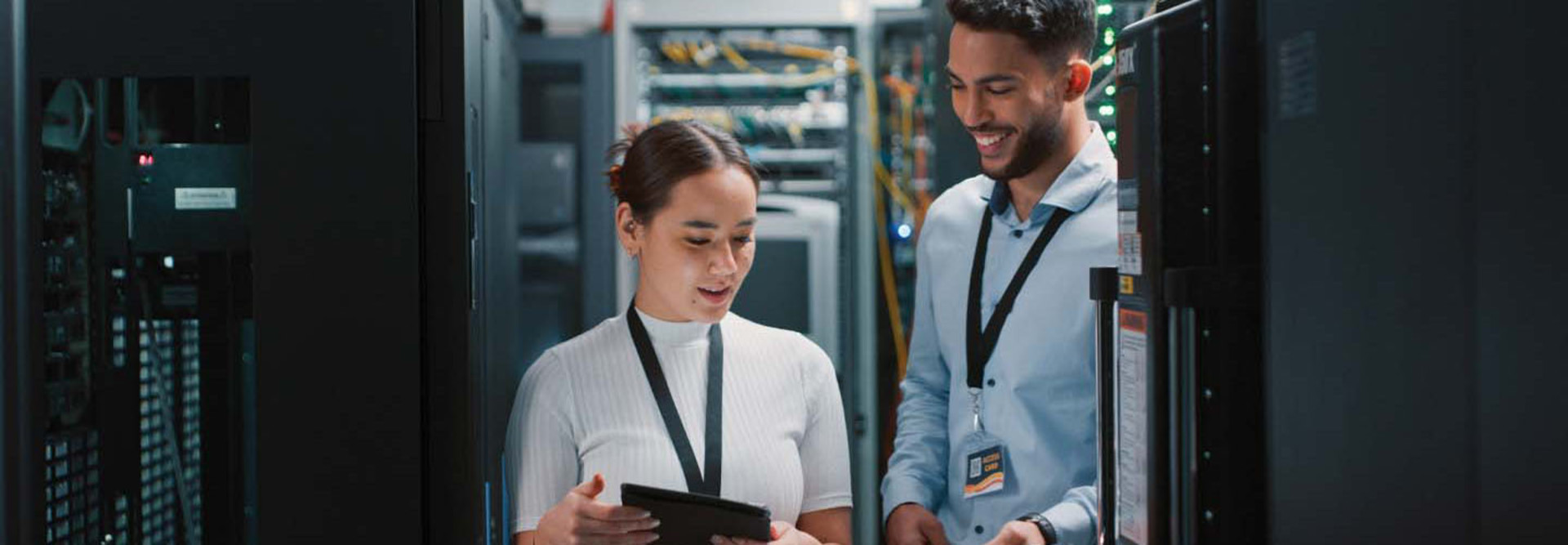 two colleagues working together in a server room
