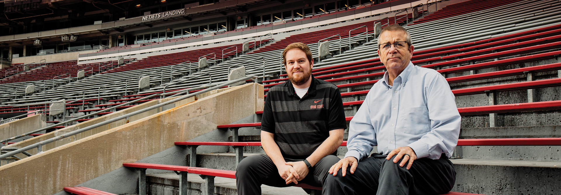 The Ohio State University's Evan Derr and Jim Null seated inside Ohio Stadium.