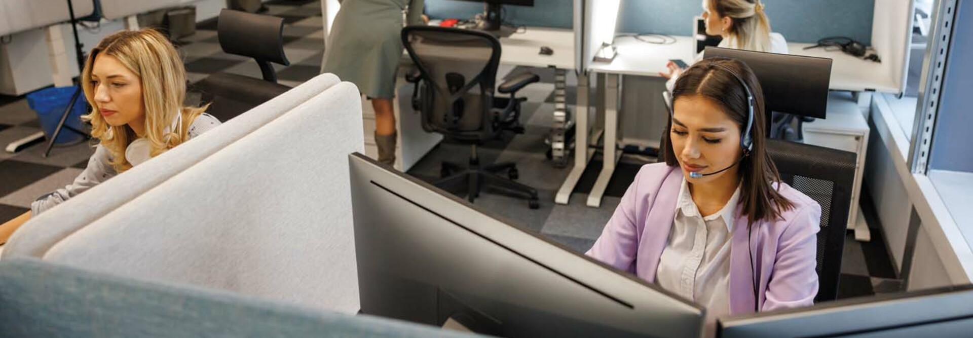 IT workers at their desks in an office