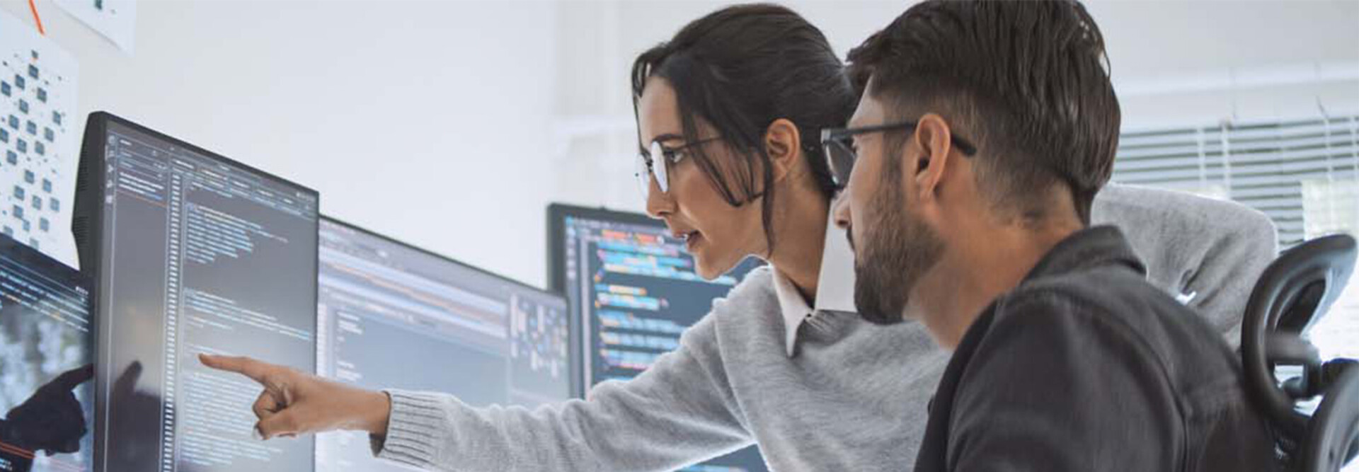 Coworkers reviewing code
