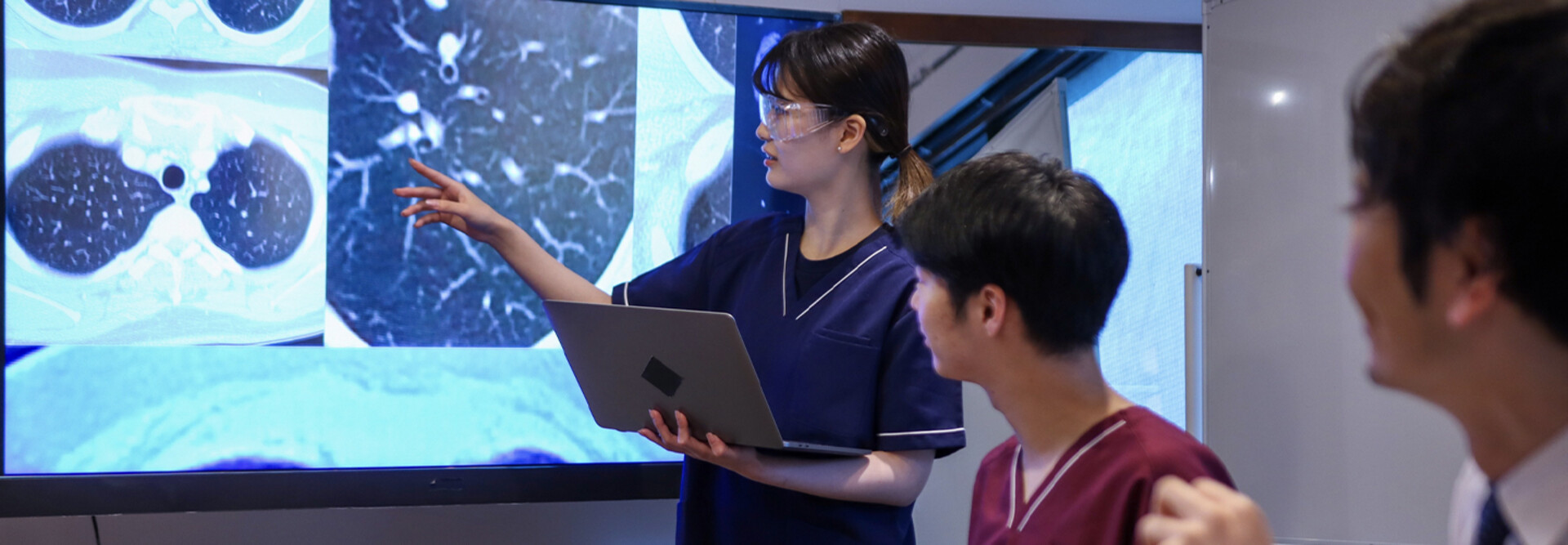 Health care professionals looking at medical x-rays