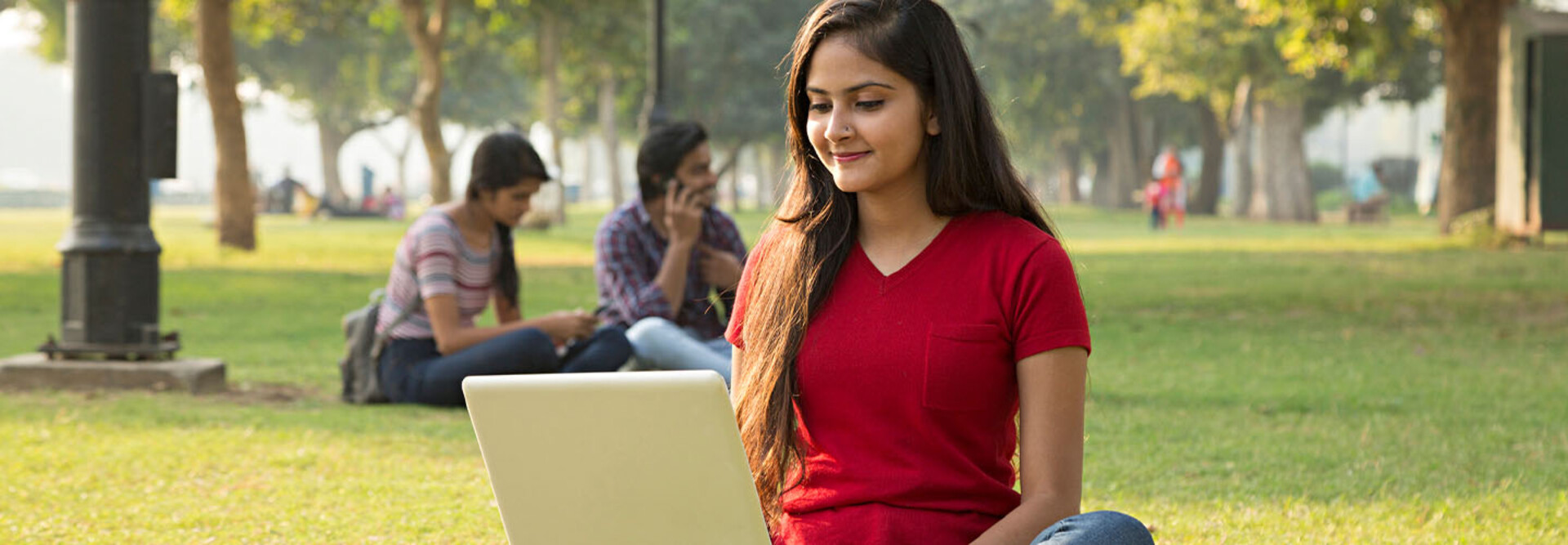 Student using laptop outside